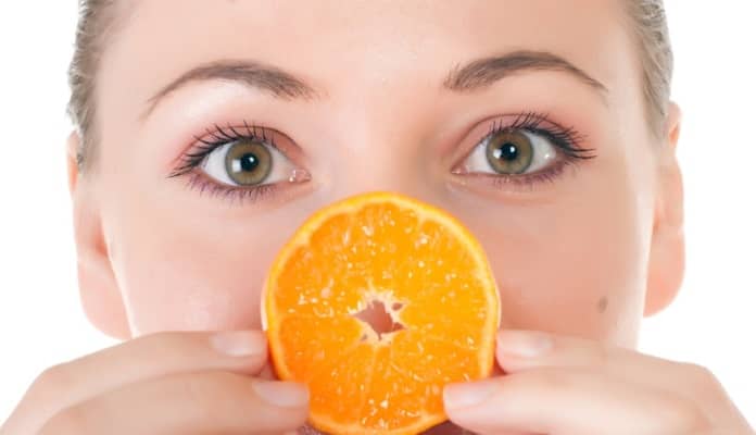Woman with half an orange